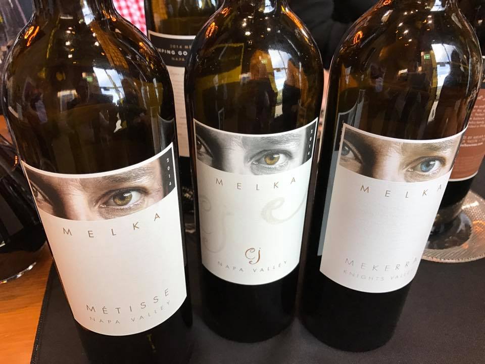 Three wine bottles with Melka labels. 